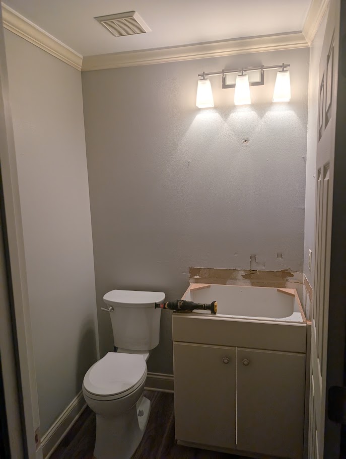 Dated two-tier kitchen peninsula before the facelift