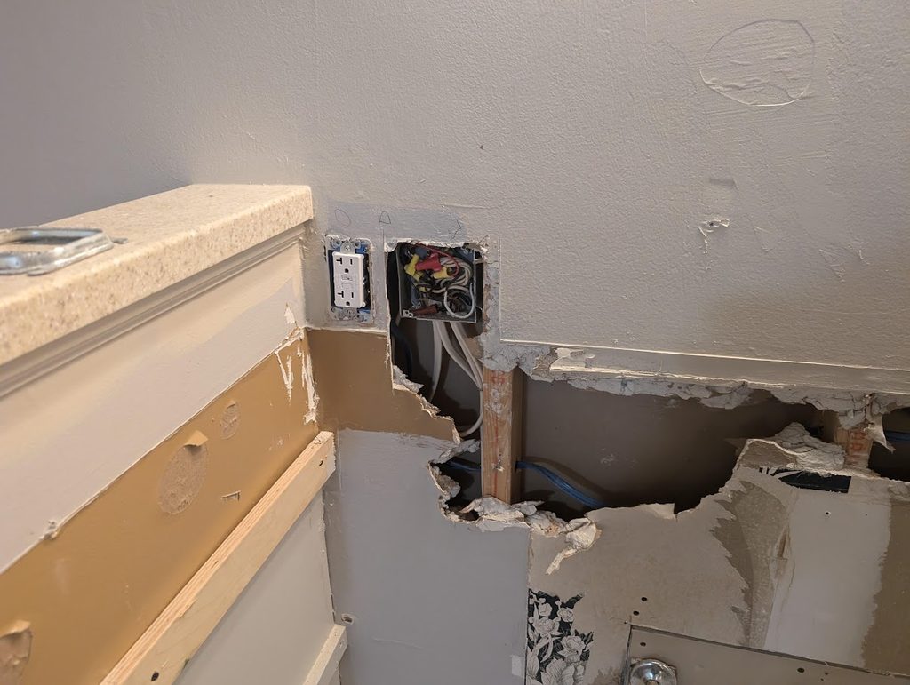Dated two-tier kitchen peninsula before the facelift