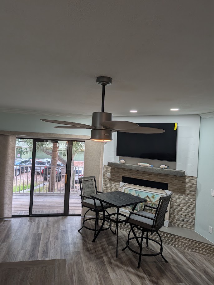 Single-tier peninsula with new backsplash and repainted cabinets
