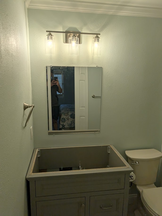 Dated two-tier kitchen peninsula before the facelift