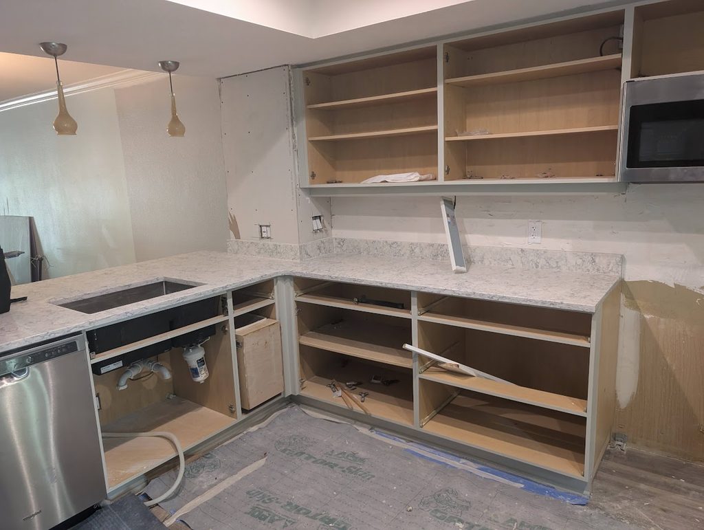 Dated two-tier kitchen peninsula before the facelift