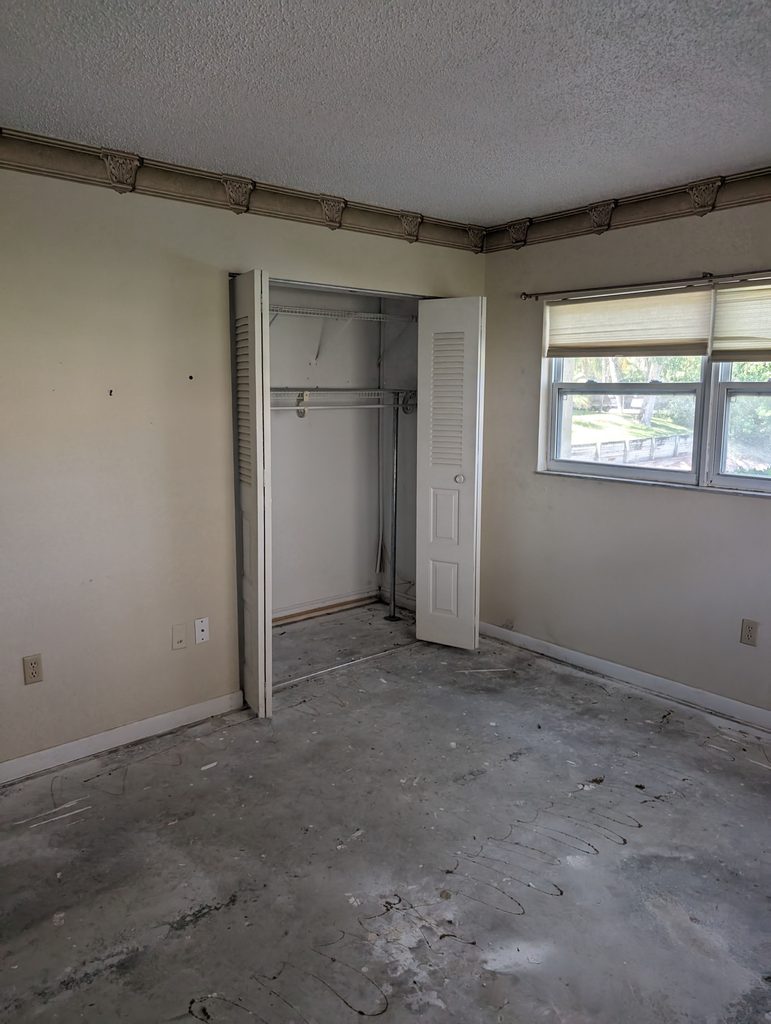 Shotgun-layout kitchen with peninsula and shaker cabinets